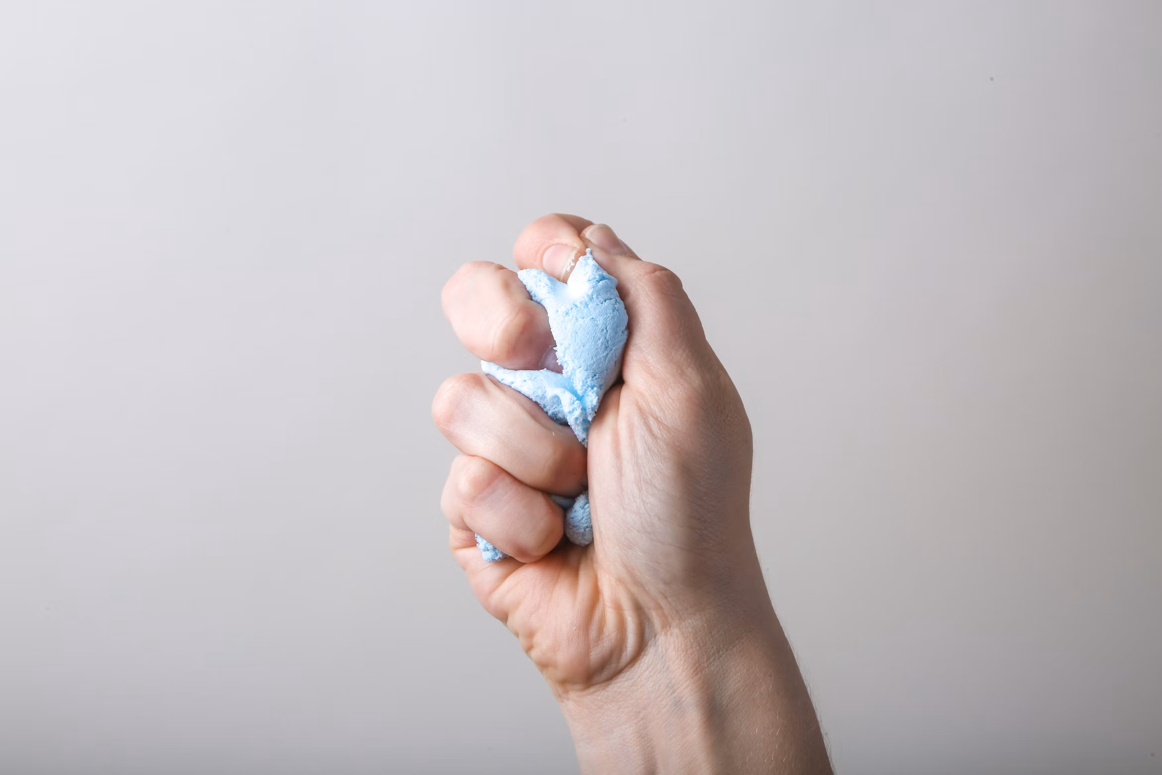 hand gripping a stress toy