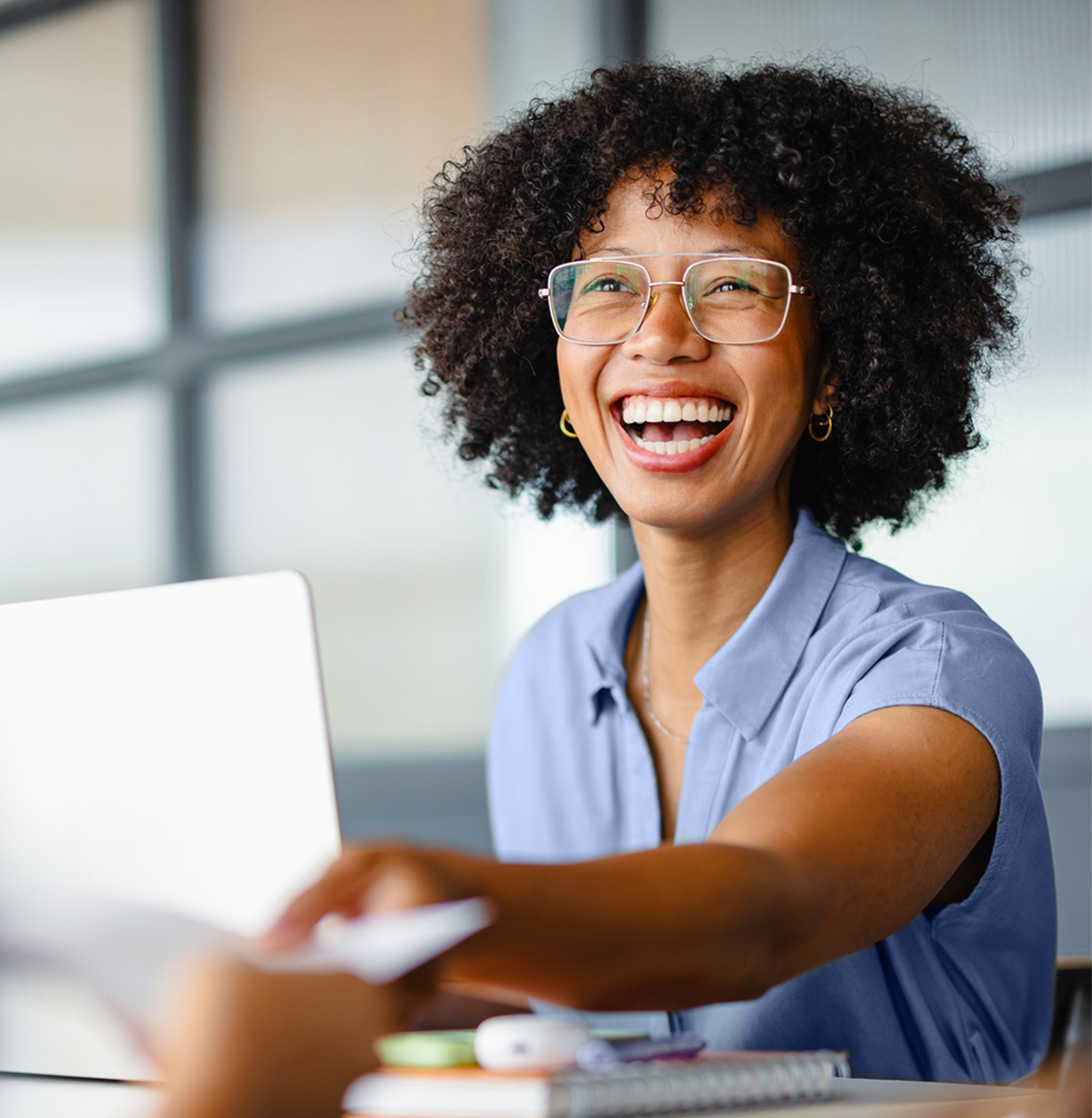 A woman smiling enthusiatically