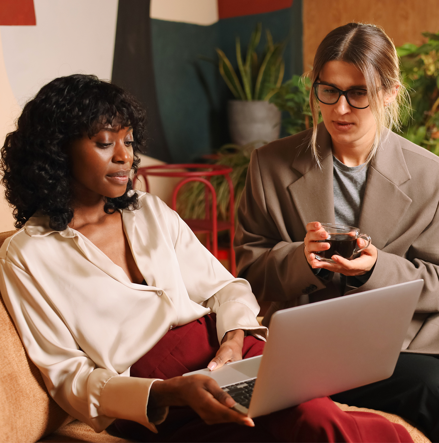 Two women looking at a laptop together